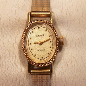 Womens Ladies Sekonda Oval Gold Plated Mechanical Wind up Watch bezel border clasp strap