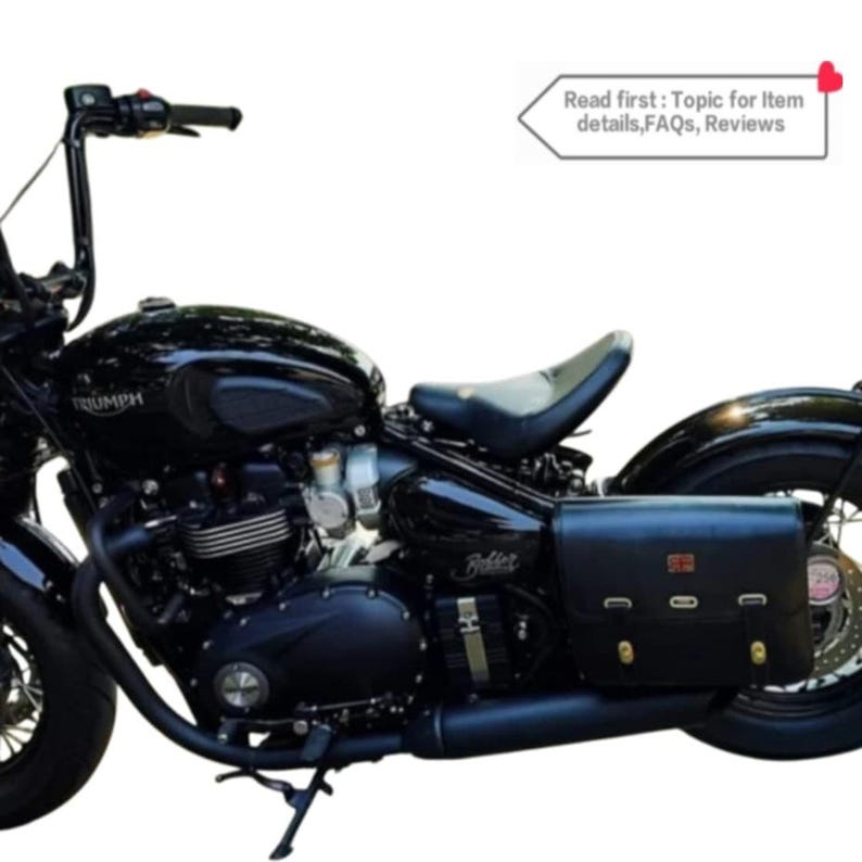 May include: A black motorcycle with a black leather saddlebag. The motorcycle has a chrome exhaust pipe and a chrome headlight. The motorcycle is parked on a grassy surface. Read first: Topic for item details, FAQs, Reviews