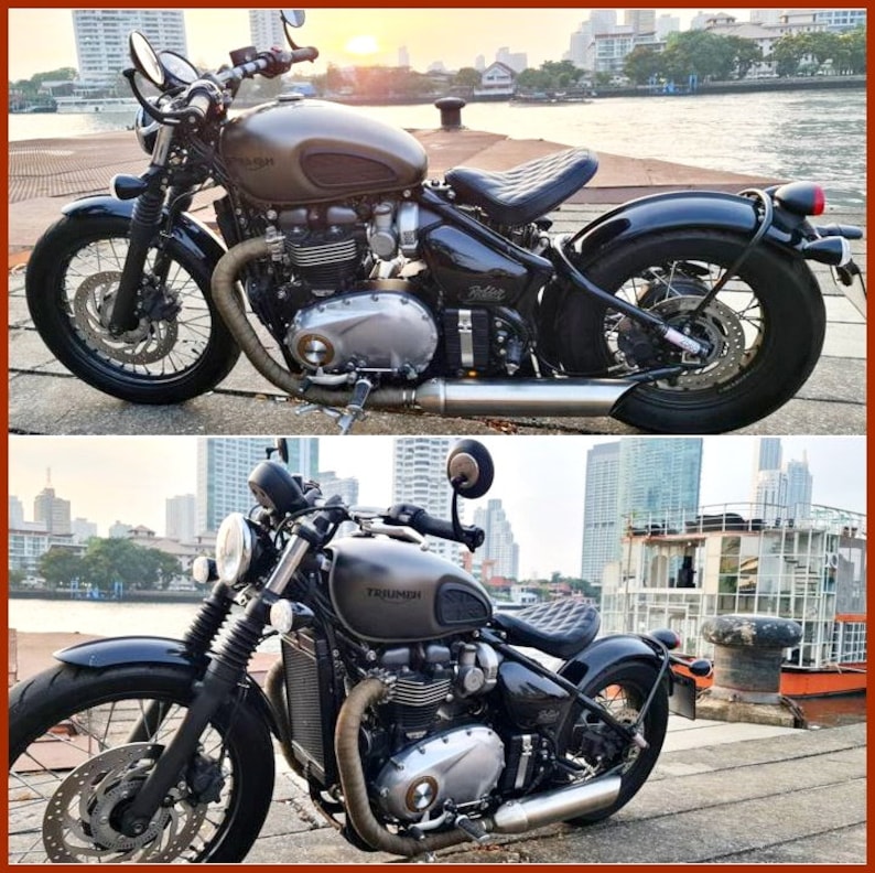 May include: A black Triumph motorcycle with a brown leather seat and chrome accents. The motorcycle is parked on a concrete surface with a city skyline in the background.