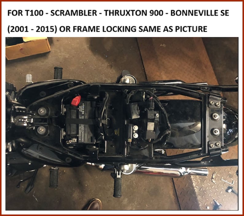 May include: A black motorcycle frame with a battery, wiring, and exhaust system. The text "FOR T100 - SCRAMBLER - THRUXTON 900 - BONNEVILLE SE (2001 - 2015) OR FRAME LOCKING SAME AS PICTURE" is visible in the image.