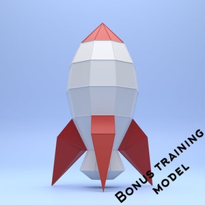 Op de afbeelding: Een witte en rode origami-raket met een puntige neus en drie rode vinnen. De raket staat op een lichtblauwe achtergrond.
