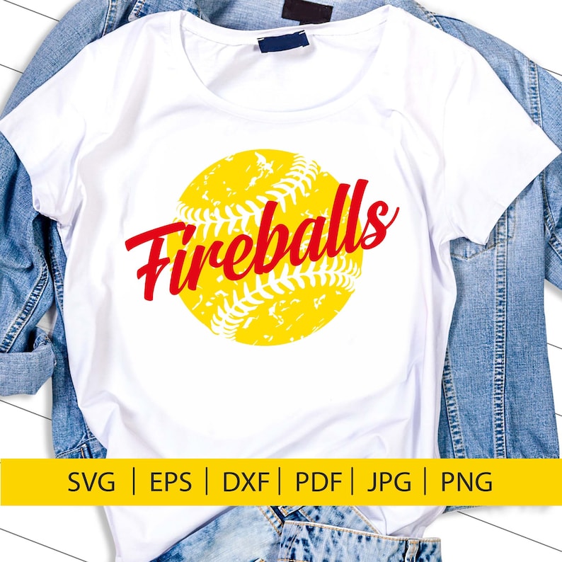 May include: A white t-shirt featuring a yellow softball with red stitching and the word "Fireballs" in red text.