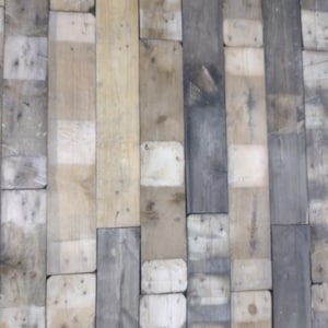 May include: A wall constructed from reclaimed wood planks, showcasing a range of wood tones and textures, including light brown, dark brown, and grey. The planks are arranged in a staggered pattern, creating a rustic and industrial aesthetic.
