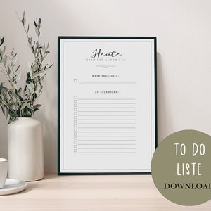 Può includere: Un elenco di cose da fare stampabile con il testo "Heute wird ein guter Tag" (Oggi sarà una buona giornata) e una sezione per un obiettivo giornaliero e un elenco di attività da completare.