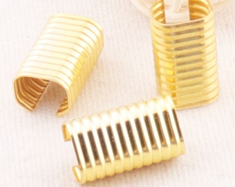 May include: Three gold metal end caps for cords or straps. The end caps are 12mm by 20mm in size.