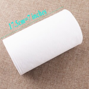 May include: White fabric roll measuring 17.5cm or 7 inches.