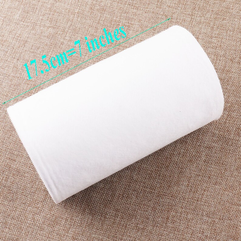 May include: White fabric roll measuring 17.5cm or 7 inches.