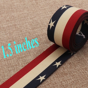 May include: Red, white, and blue striped fabric ribbon with white stars. The ribbon is 1.5 inches wide.