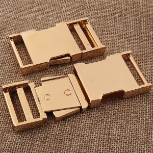 May include: Two gold-colored plastic buckle closures for straps or belts. The buckles are designed to be used with a strap or belt that is 1 inch wide.