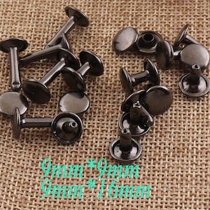 May include: A close-up of a group of black metal rivets. The rivets are 9mm in diameter and have a 16mm shank length. They are commonly used for leather craft projects.