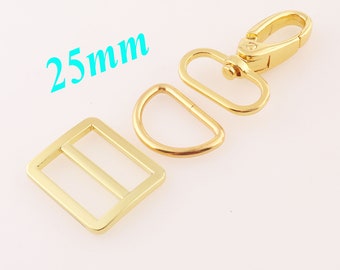 May include: Gold-toned metal hardware set for bags or other crafts. The set includes a 25mm D-ring, a 25mm slider buckle, and a 25mm swivel hook.