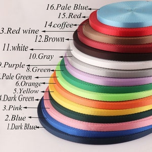 May include: A collection of 16 different coloured webbing straps, arranged in a stack from darkest to lightest. The colours are: dark blue, blue, pink, dark green, yellow, orange, pale green, green, purple, grey, white, brown, red wine, coffee, red, and pale blue.