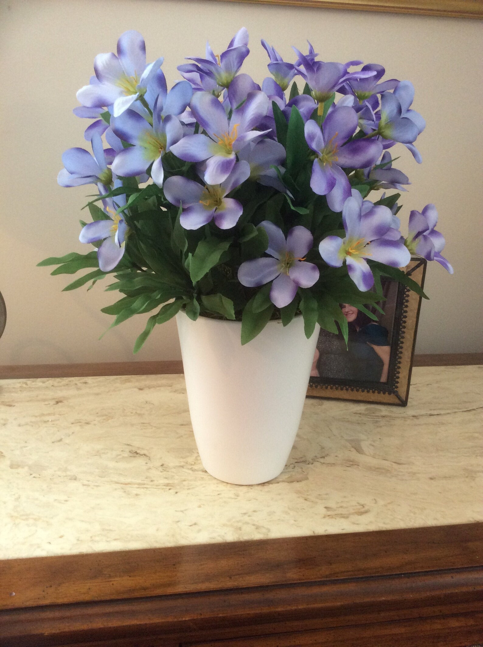 White round ceramic vase full of purple and green silk flowers Etsy