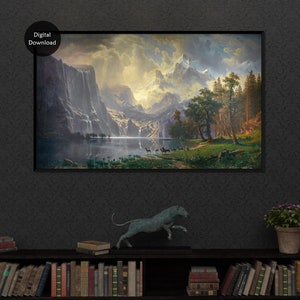 Puede incluir: Una descarga digital de una pintura que representa una cordillera con un lago en primer plano. El cielo est&aacute; nublado y las monta&ntilde;as est&aacute;n cubiertas de nieve. Hay &aacute;rboles en primer plano y algunos ciervos en el lago.