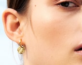 Small hoop earrings gold colored. With round gold-plated brass plate pendant. Mat and shine. Beautiful look. Hoops