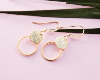 Minimalist earrings in gold, rose gold, or silver. A subtle circle with a hammered disc. A great gift.