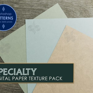May include: Three different coloured paper textures with a decorative pattern in the centre of each sheet. The paper textures are green, blue, and beige. The text "SPECIALTY DIGITAL PAPER TEXTURE PACK" is at the bottom of the image.