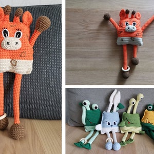 May include: A collection of crocheted stuffed toys, including a giraffe, a bunny, and a frog. The toys are all orange, green, and blue, and they have long legs and arms. They are all sitting on a wooden surface.