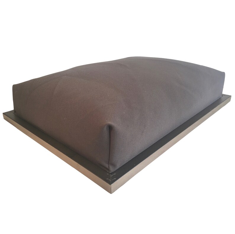 May include: A gray fabric ottoman with a black metal frame. The ottoman is rectangular and has a simple design.