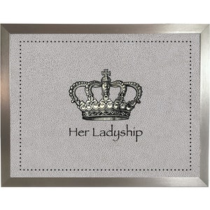 May include: A framed print with a silver frame and a gray background. The print features a black and white illustration of a crown with the text "Her Ladyship" underneath.