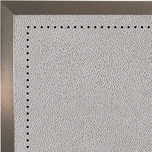 May include: Close-up of a white textured surface with a silver frame. The surface has a dotted border.