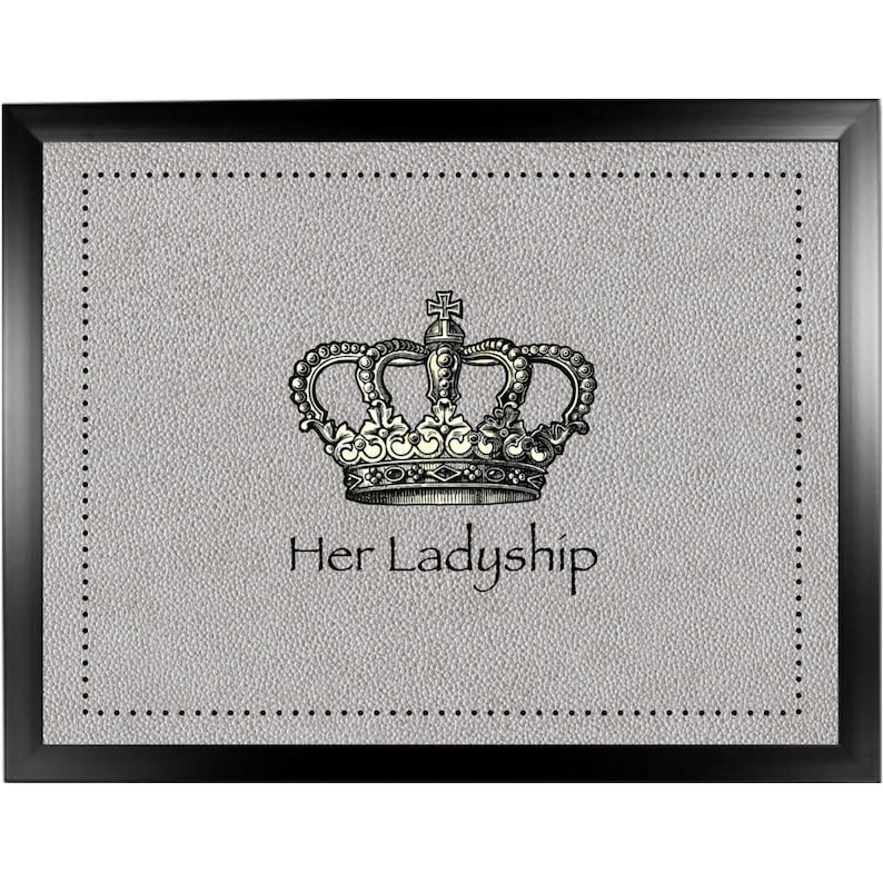 May include: A black framed tray with a gray textured surface. A silver crown with a cross on top is in the center of the tray. The text "Her Ladyship" is below the crown.