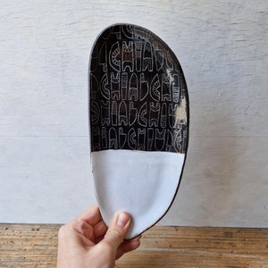 Oval serving platter with carved geometric pattern, black stoneware pottery, durable quality ceramics
