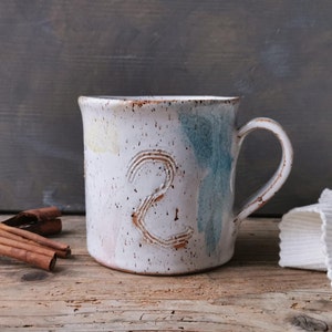 Artist&#39;s mug, white ceramic mug with pastels