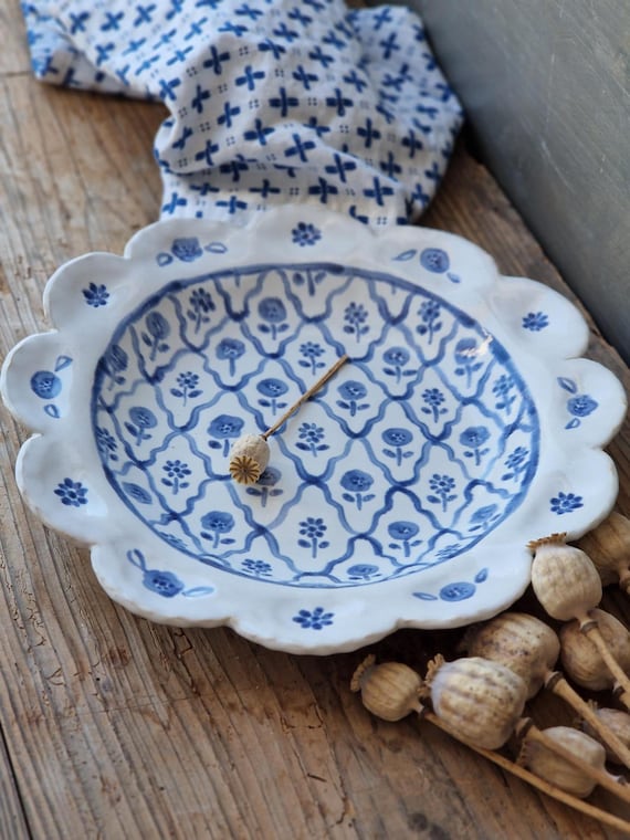 Slightly flawed floral ceramic plate or shallow bowl with scalloped rim, medium decorative ceramic bowl