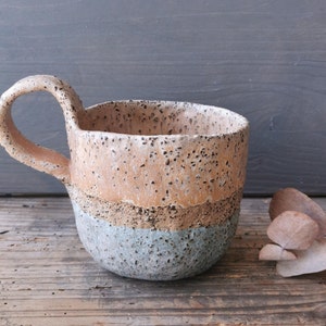 Rustic ceramic mug with high handle