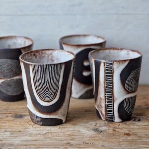 Handmade ceramic tumbler: black and white geometric beaker