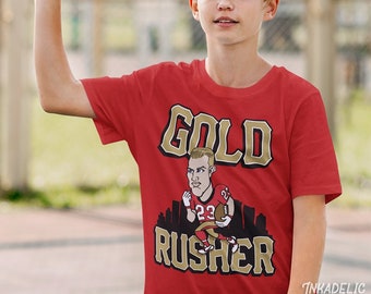 Camiseta juvenil para niños Christian McCaffrey Gold Rusher CMC 49ers San Francisco Niners Cool Fan Gear Bay Area Deebo Samuel SF San Fran Jimmy G