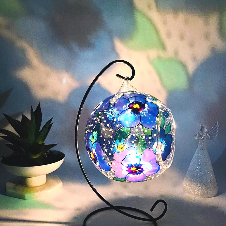 Hand Painted hanging glass candle holder with metal stand, with blue pansies and green leaves. Great choice as a unique gift for Mothers Day, Christmas Gift, Unique Birthday Gift, this glass tealight holder will truly impress the receiver.