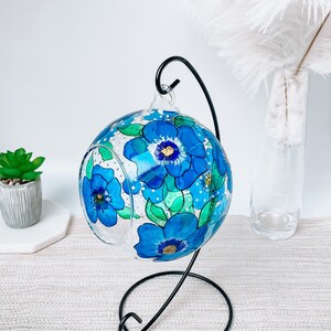 Hand Painted hanging glass candle holder with metal stand, with blue pansies and green leaves. Great choice as a unique gift for Mothers Day, Christmas Gift, Unique Birthday Gift, this glass tealight holder will truly impress the receiver.