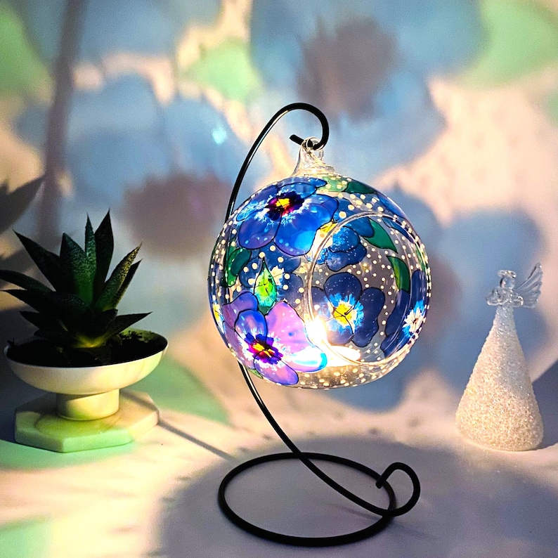 Hand Painted hanging glass candle holder with metal stand, with blue pansies and green leaves. Great choice as a unique gift for Mothers Day, Christmas Gift, Unique Birthday Gift, this glass tealight holder will truly impress the receiver.