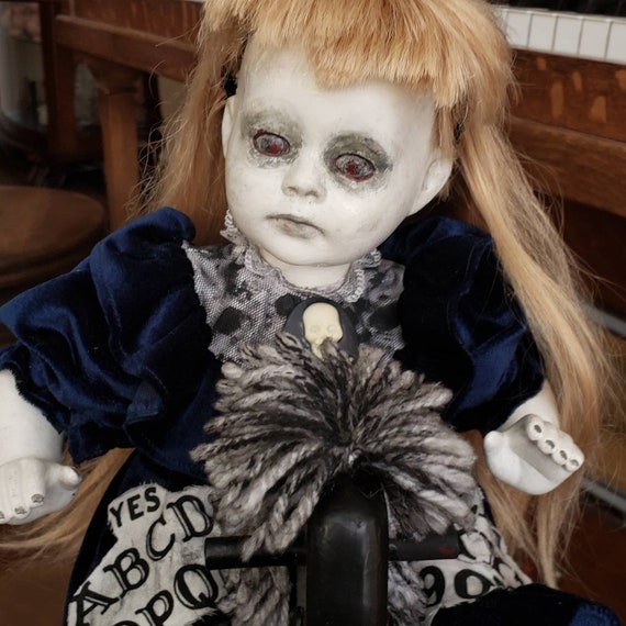 scary doll on rocking horse