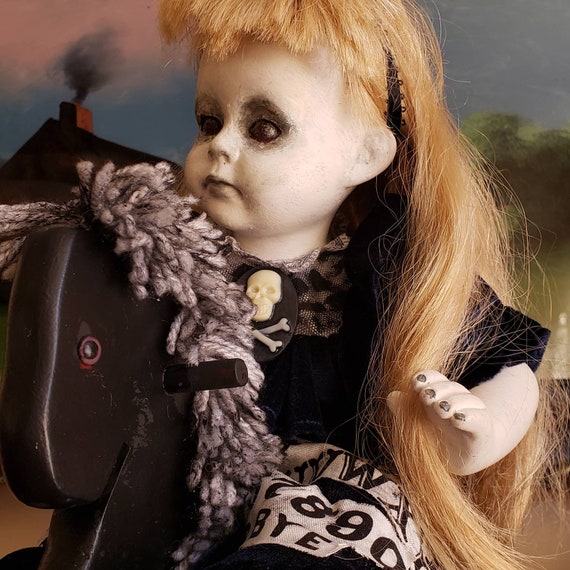 scary doll on rocking horse