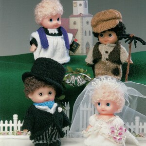 May include: A vintage craft pattern cover titled "Tickle Tums Wedding." The image features four knitted dolls dressed as a bride, groom, and wedding party. The background includes a church and a white picket fence.