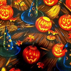 May include: A Halloween-themed pattern featuring carved orange jack-o'-lanterns with glowing yellow faces, witch hats, brooms, and autumn leaves. The background is a dark brown color.