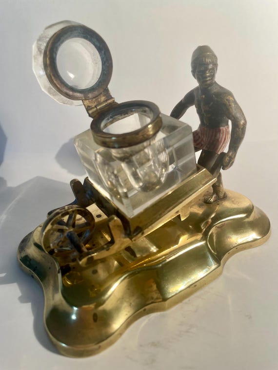 Cold painted  bronze (Nubian) man with antique cut glass  inkwell