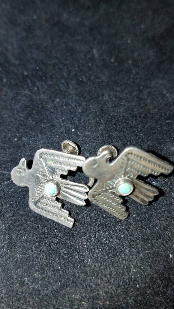 Turquoise earring. Thunderbird earring. Sterling.