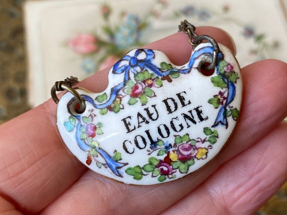 Unusual antique hand painted ‘Eau de Cologne’ scent crown Staffordshire pottery /porcelain perfume bottle label (b) ( 1 )