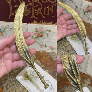 Abridor de cartas de latão com garras e penas de pássaro, novidade incomum, com selo em branco (D1)