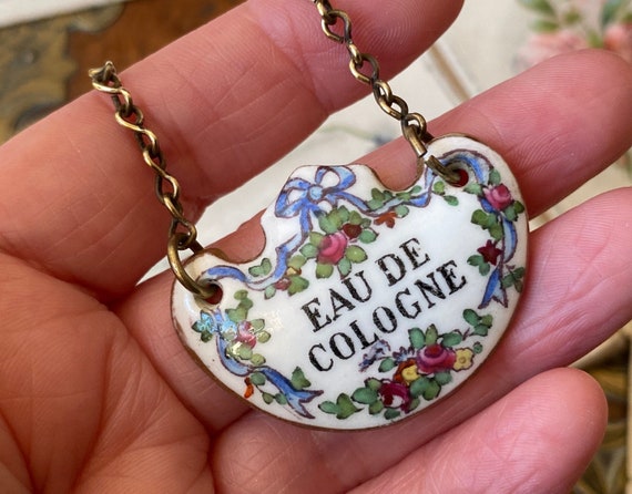 Unusual antique hand painted ‘Eau de Cologne’ scent crown Staffordshire pottery /porcelain perfume bottle label (a) ( 1 )