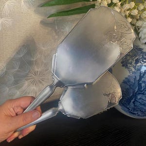 Fabulous vintage English hallmarked sterling silver engine turned and daffodils design vanity set brush and hand mirror ( I )