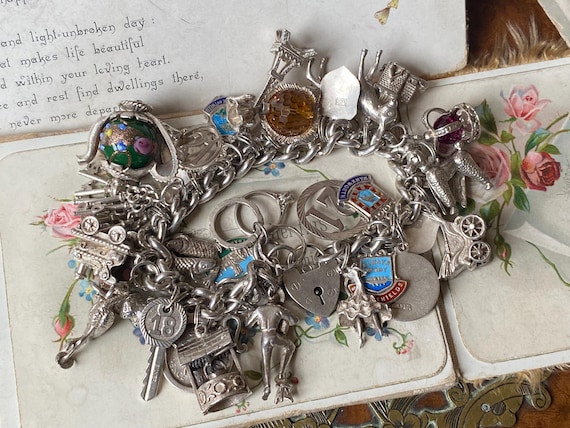 Heavy silver charm bracelet best sale