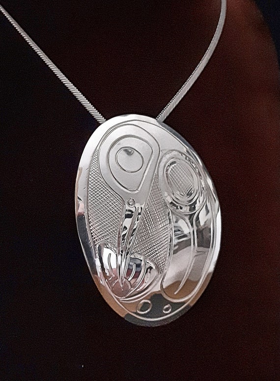 Oval Northwest coast with whale