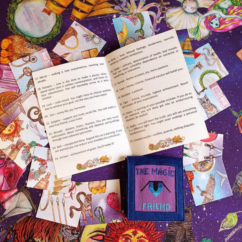 Multiple cards face-up showing symbolic scenes from the patience game deck.