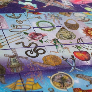Close-up of several patience game cards showing hand-drawn mystical imagery on a cosmic background.
