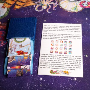 Magic Friend textile pouch and printed instruction sheet on the reading cloth.